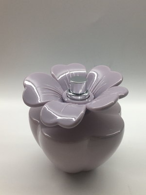 Customized 100ml Spray Perfume Bottle Oval Glossy Blue Bottle Flower Shaped Cap