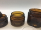 Transparent Cosmetic Refill Amber Glass Jar Straight Round Shape With Plastic Black Lid